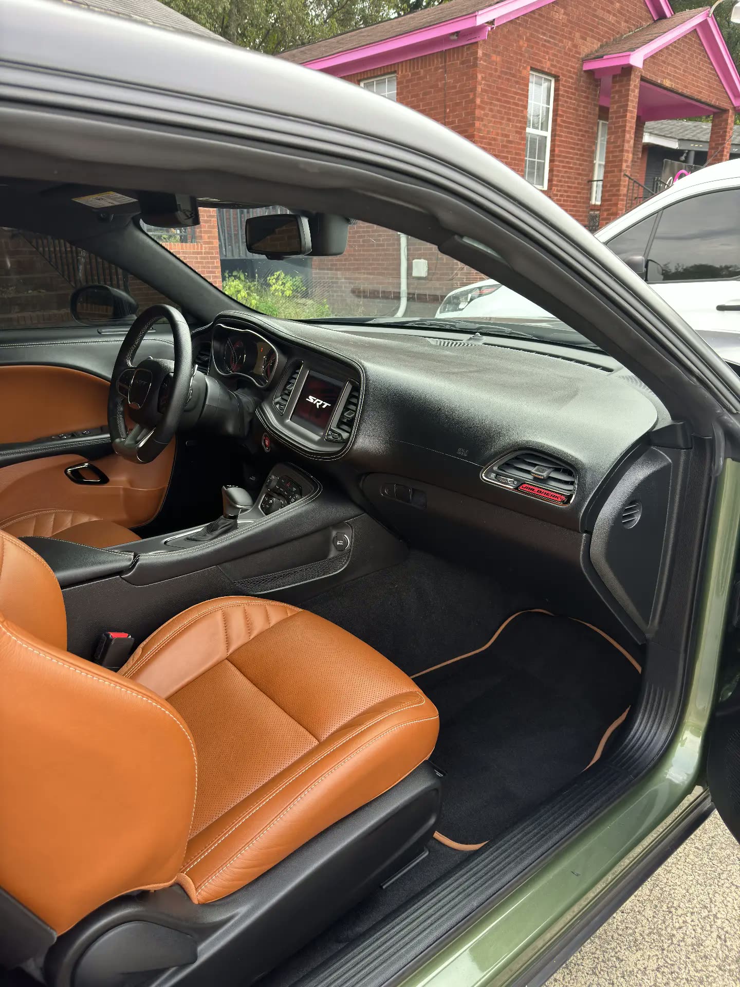 Cleaned dash and brown leather in a Dodge Challenger SRT interior