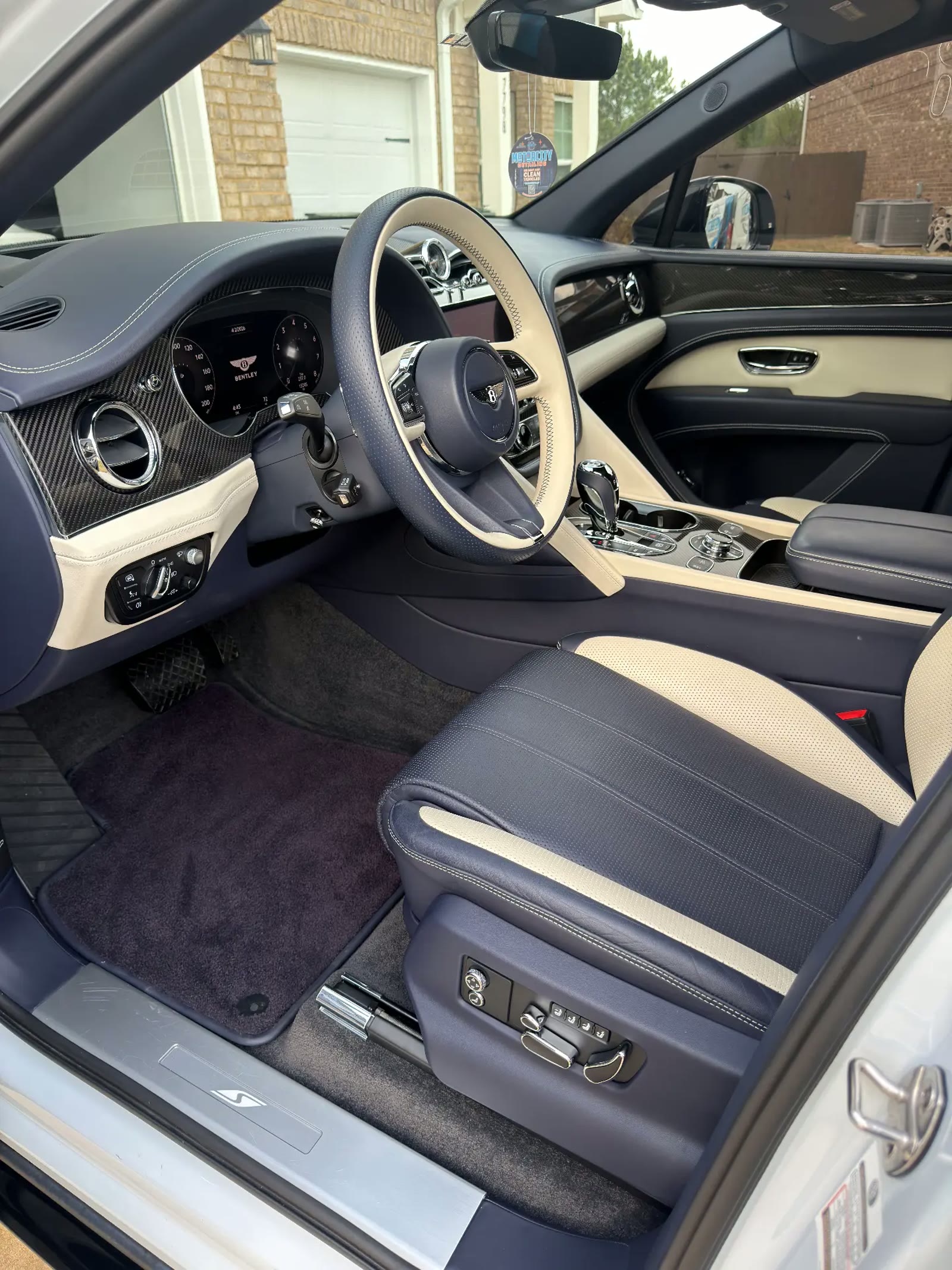 Interior detailing on a Bentley Bentayga cockpit, dash and steering wheel