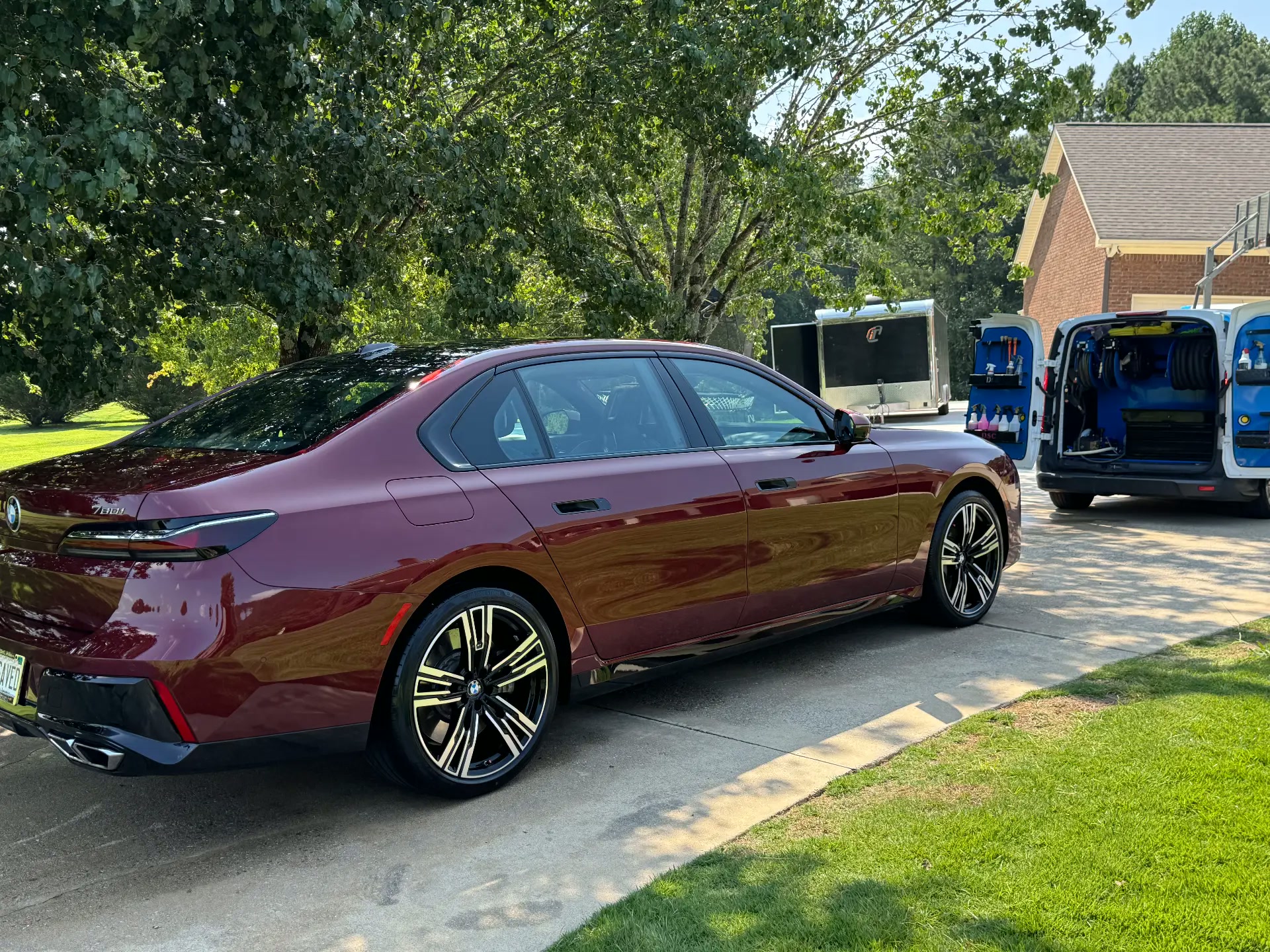 Maroon BMW 7 Series with the Motorcity Detailing mobile unit in Brentwood, TN