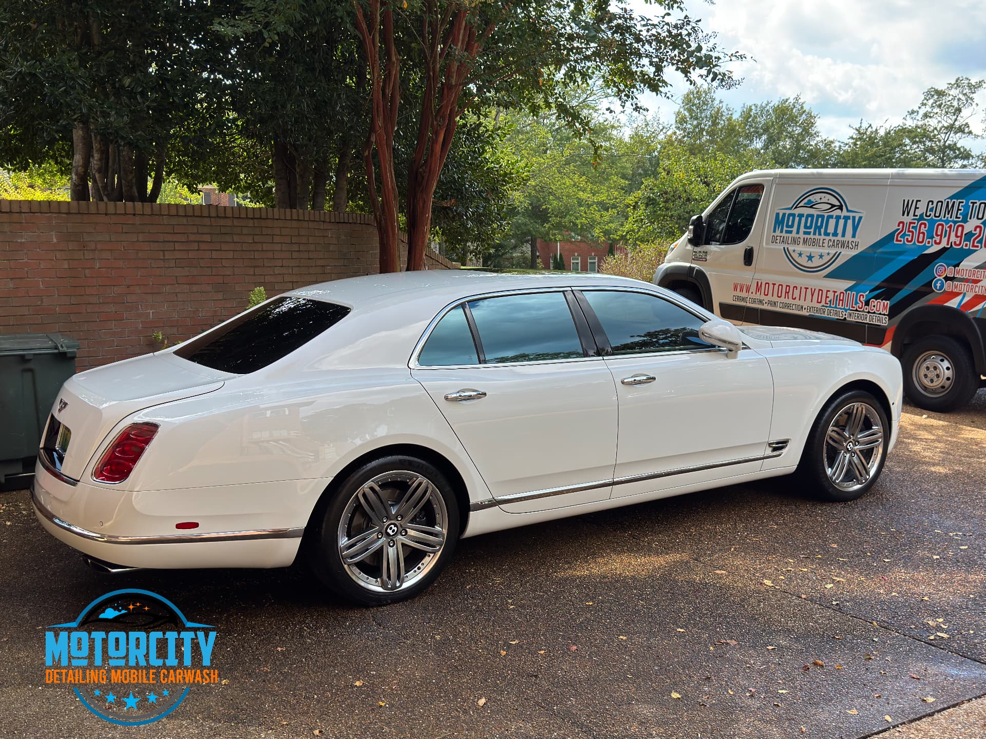 White Bentley Mulsanne detailed by Motorcity Detailing next to the mobile detailing van