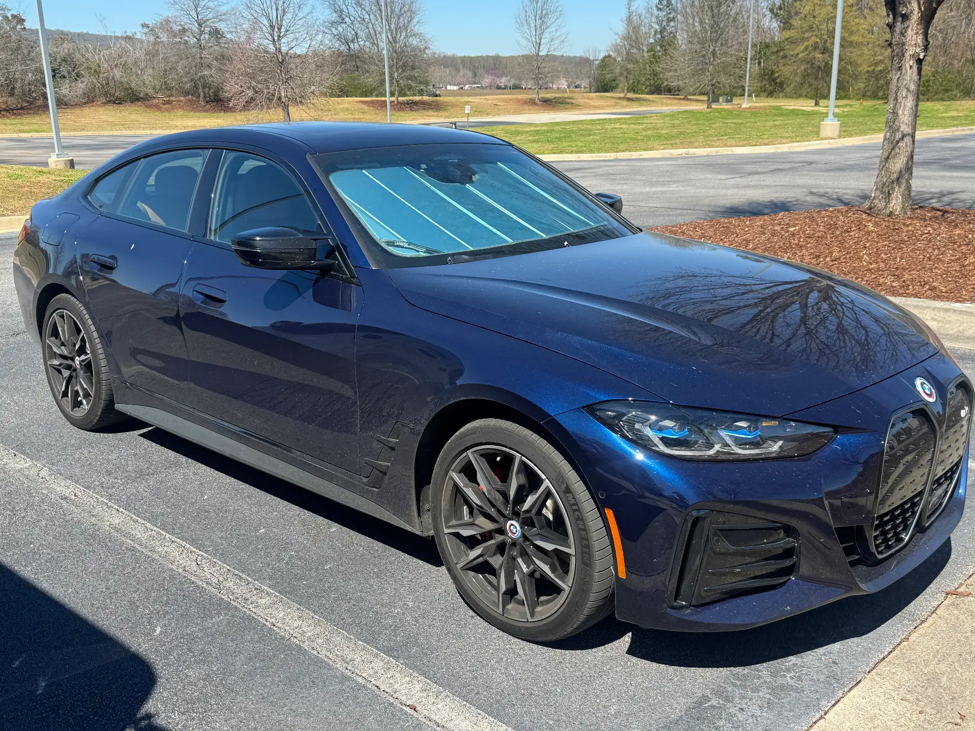 Dark blue BMW i4 with a glossy finish after an exterior detail