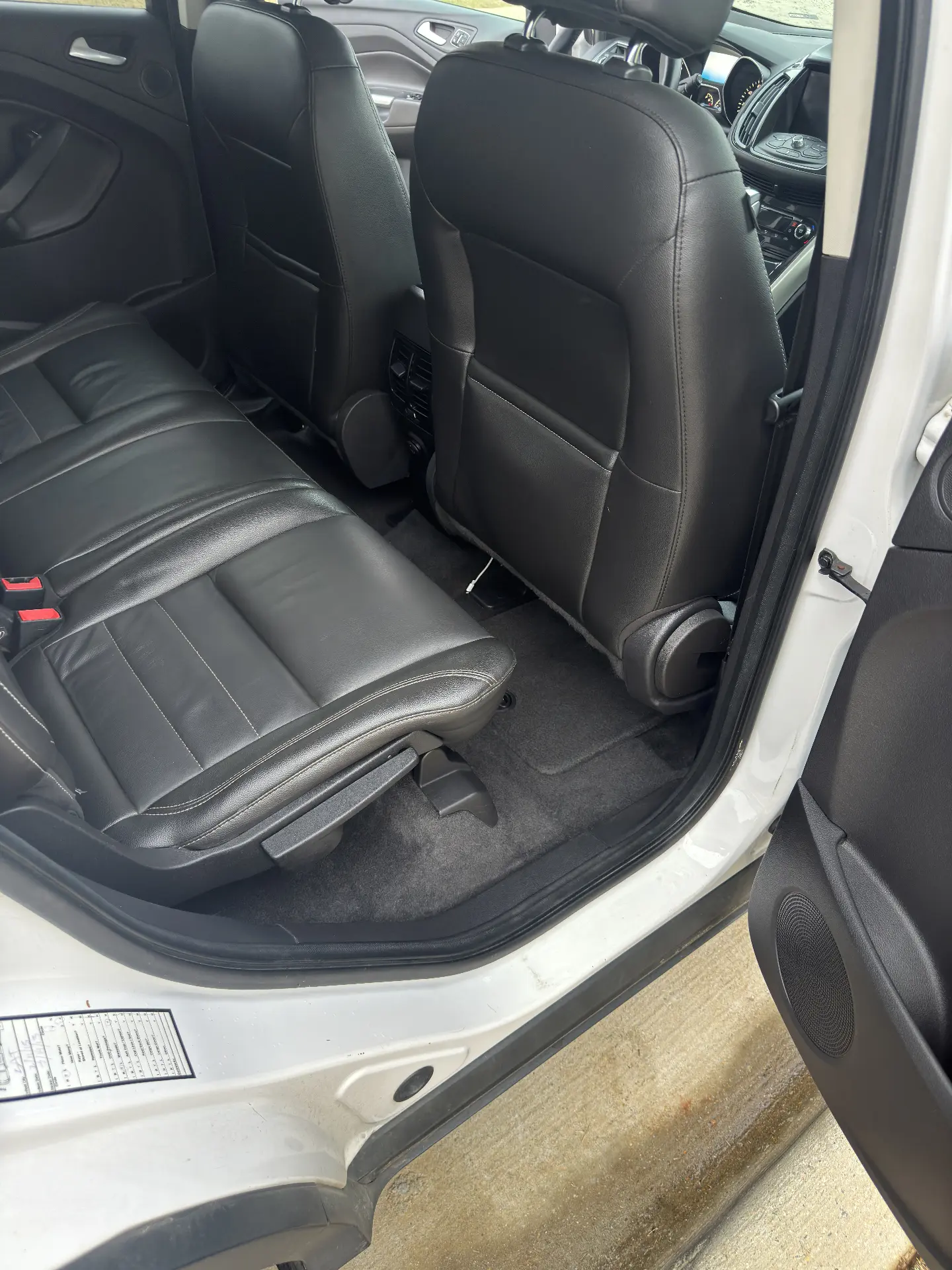 SUV rear leather seating and carpet cleaned after a full interior detail