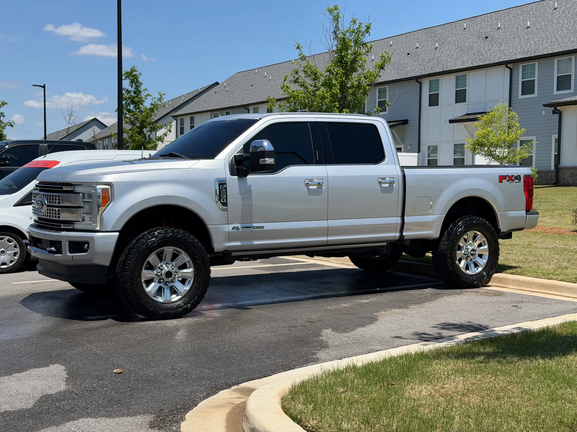 Exterior detailing finished on a white Ford F-250 Platinum pickup
