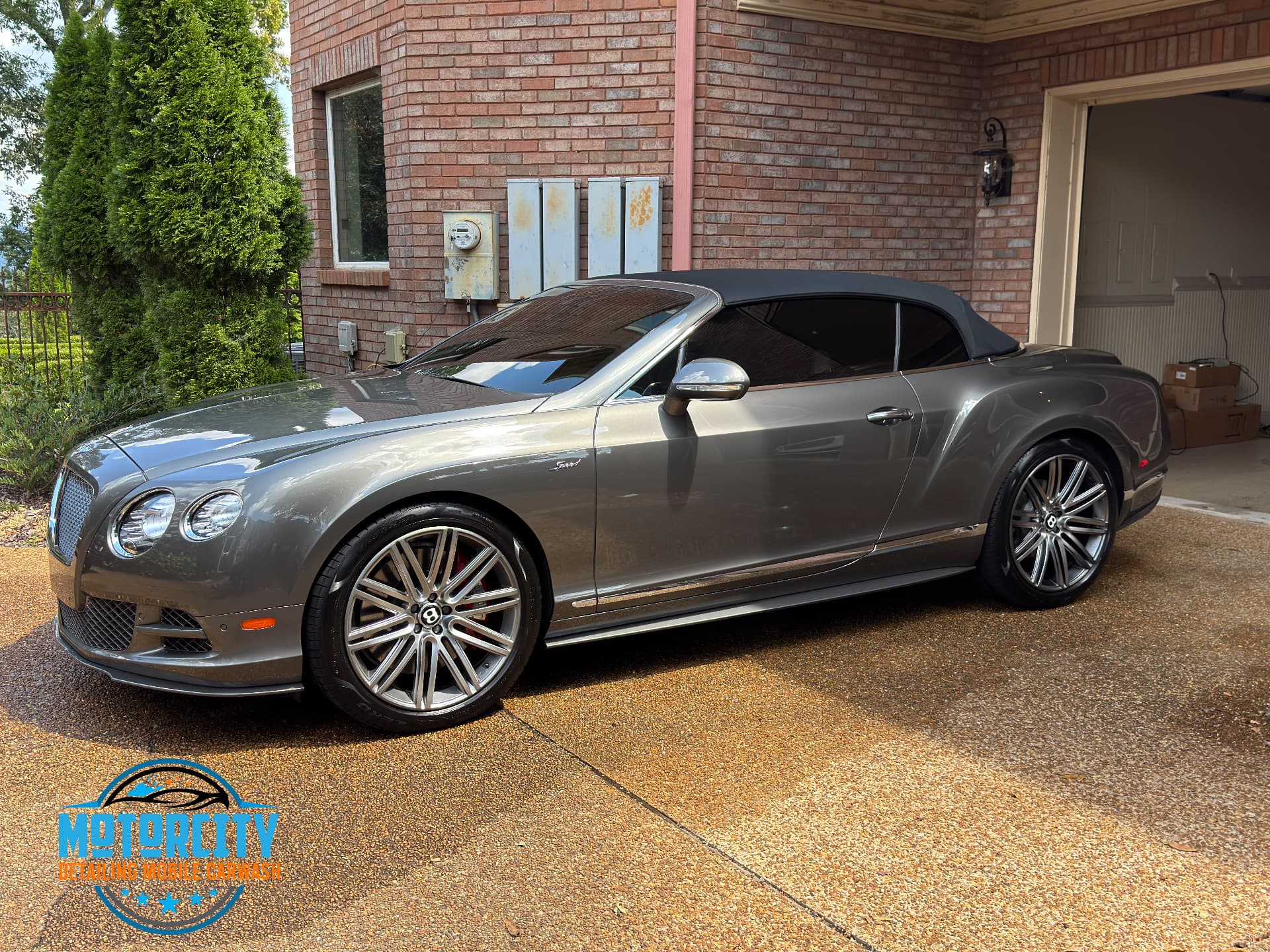 Silver Bentley Continental GT Speed convertible cleaned in a driveway in Brentwood, TN